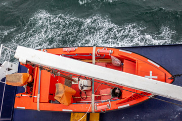 Orange lifeboat on Kaitaki ferry view from the upper deck