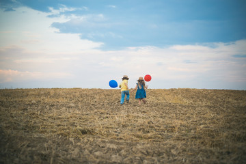 Friendship children and support. Back view. International friendship day. Two little kids playing together outdoor. Summer fun, vacations concept.