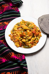 Mexican scrambled eggs with tomato and chili pepper also called 