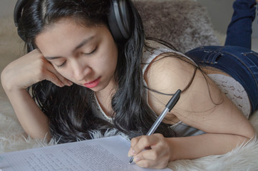 girl writing in notebook