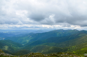 Beautiful view of mountains landscape with cloudy sky. Chornohora mountain ridge and beautiful...