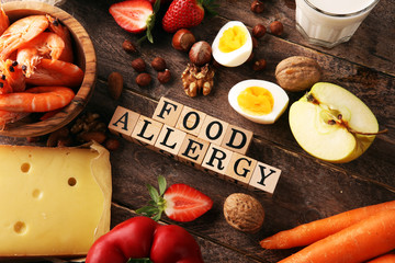 Allergy food concept. Allergy food as almonds, milk, cheese, strawberry, seeds, eggs, peanuts and...