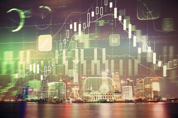 Financial graph on night city scape with tall buildings background multi exposure. Analysis concept.