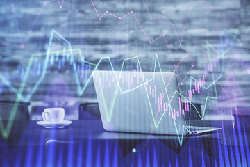 Stock market graph and table with computer background. Double exposure. Concept of financial...