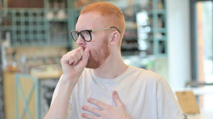 Portrait of Sick Redhead Man Coughing