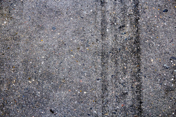Tire tracks on the pavement. Background texture.