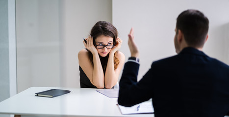 Boss Blaming Female Executive