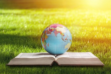 Classic globe planet and open book