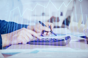 Financial trading graph multi exposure with man desktop background.