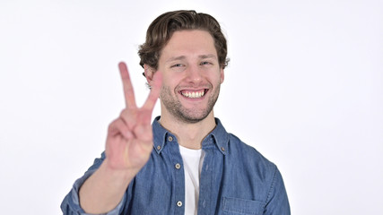 Victory Sign by Positive Young Man on White Background