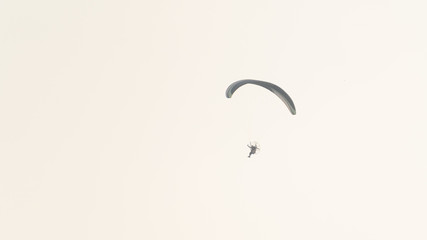 Paramotor glider pilots flying in the sky