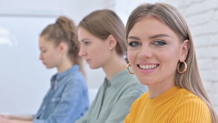 Close Up of Young Woman Smiling at the Camera