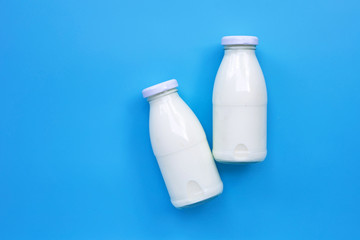 Milk bottle on blue background.
