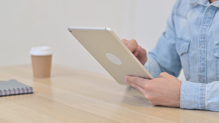 Hands of Man using Digital Tablet, Close up