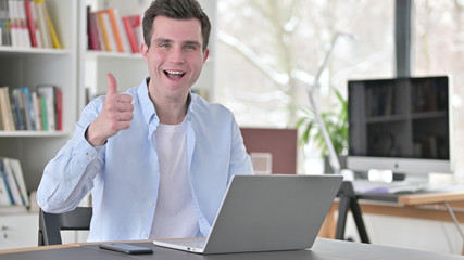 Thumbs Up by Young Man on Laptop