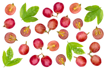 Grapes fruit with half slice and green leaf pattern texture background. Top view. Flat lay.