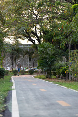 The elderly walking on the field.
