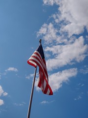 american flag of united states of america sky clouds stripes patriotic flying waving american pride red white blue stars usa 