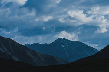 thick clouds over rock ridge, bad weather and waiting for rain in  mountains