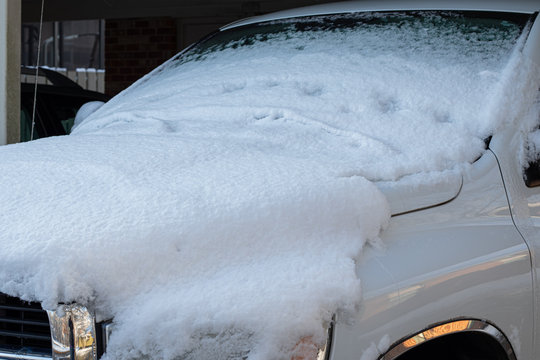 A Pick Up Truck Covered In Snow After A Winter Storm.