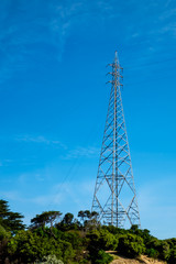 A high electric pole and transmission line on an island