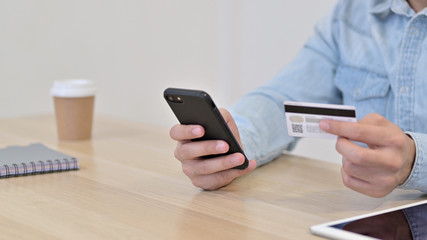 Credit Card Payment on Smartphone by Man, Close up