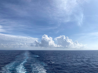 Landscape.Look at the horizon in the open sea.Beautiful natural background.Line horizon of the blue ocean and sky with white clouds.Horizontal, free space, no one.Concept of natural beauty.