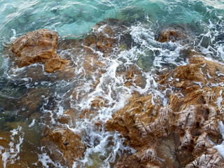 Wave at the rocky coast