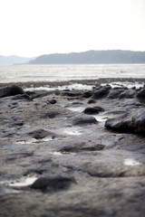 Fototapeta na wymiar Taffoni. A big rock on the beach in Taean-gun, South Korea.
