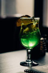 green cocktail on a table