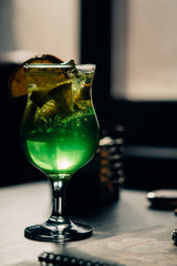 green cocktail on a table