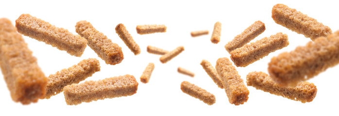 Bread croutons levitate on a white background