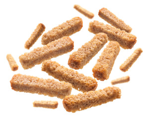 Bread croutons levitate on a white background