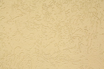 Yellow striated stucco wall texture