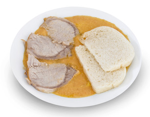 Traditional slovak food: Svieckova. Tenderloin on Cream. Tenderloin on ceramic plate. Isolated on white background. With clipping (vector) path. Beef sirloin in cream sauce with bread dumpling.