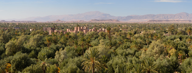 Kasbah Amridil in the Skoura oasis Palm Grove Dades Valley with High Atlas Mountains Morocco