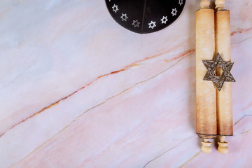 Jewish manuscript, papyrus roll on abstract background.