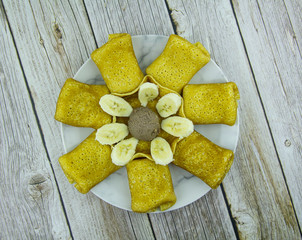 Pancakes with cottage cheese, bananas and chocolate peanut paste