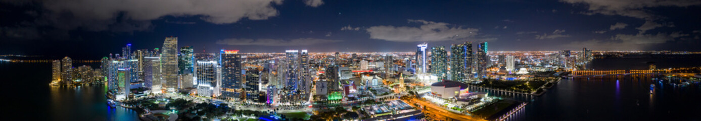 Fototapeta na wymiar Amazing aerial panorama of Downtown Miami FL USA at night with bright city lights