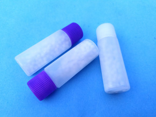 white plastic medicine bottle isolated on blue sky background