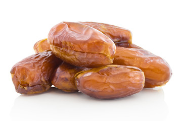 A pile of dried dates without stone. Isolated on white background with shadow reflection. With clipping path. With vector path. Stoneless dates on white bg.