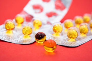 The fish oil pills closeup. Background