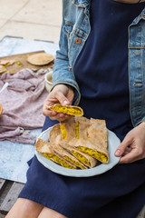 Homemade stuffed bread, cabbage pie slices. Little girl and mother have food together. Family food care concept