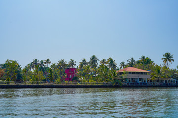 Beautiful river side tree and house view in kochi Kerala India.