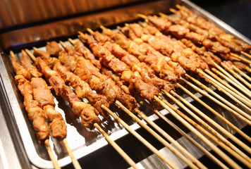 Animal meat on wooden sticks for grilling