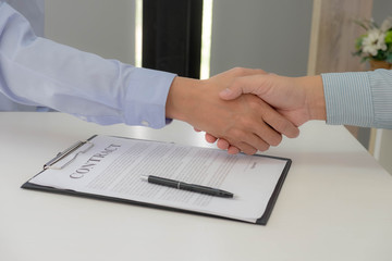 Shaking hands with success, happy to enter into business swaps