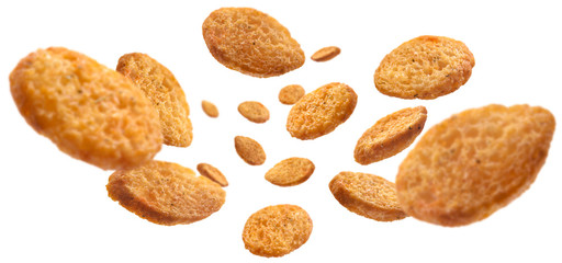 Bread croutons levitate on a white background