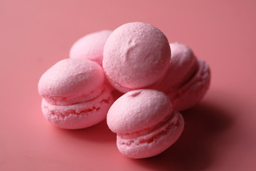 close up of pink color macaroon on pink background 