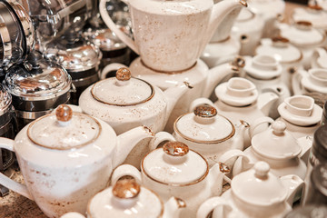 Group of empty cups and teapots in many rows. Tableware for coffee and tea in breakfast and seminar event.