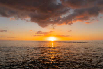 Sun Set over Hawaiian Ocean with Colorful Clouds